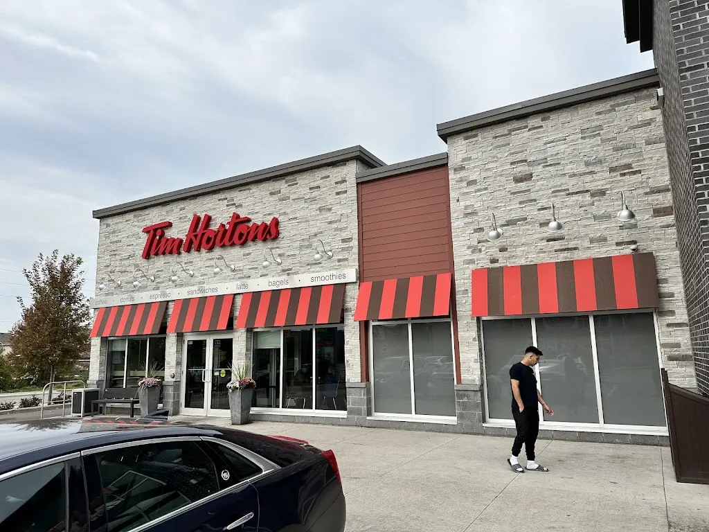 Tim Hortons storefront and interior at 304 Stone Rd, Guelph, ON