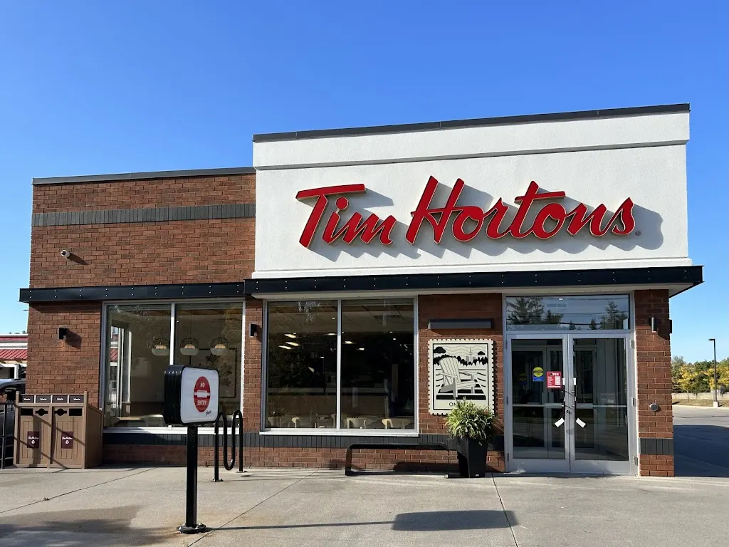 Tim Hortons storefront and interior at 698 Woolwich St, Guelph, ON