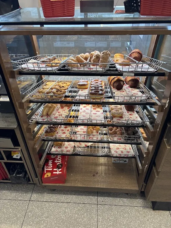 Tim Hortons storefront and interior at 1622 Roger Stevens Dr., Kars, ON