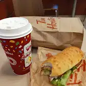 Tim Hortons storefront and interior at 704 King St West, Kingston, ON
