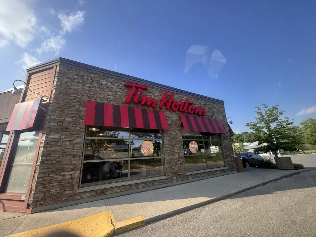 Tim Hortons storefront and interior at 511 Commissioners Rd West, London, ON