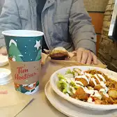 Tim Hortons storefront and interior at 511 Commissioners Rd West, London, ON