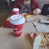 Tim Hortons storefront and interior at 1200 Commisioners Rd East, London, ON