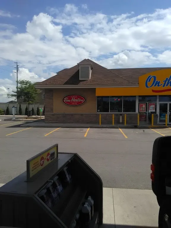 Tim Hortons storefront and interior at 10750 Jane St, Maple, ON