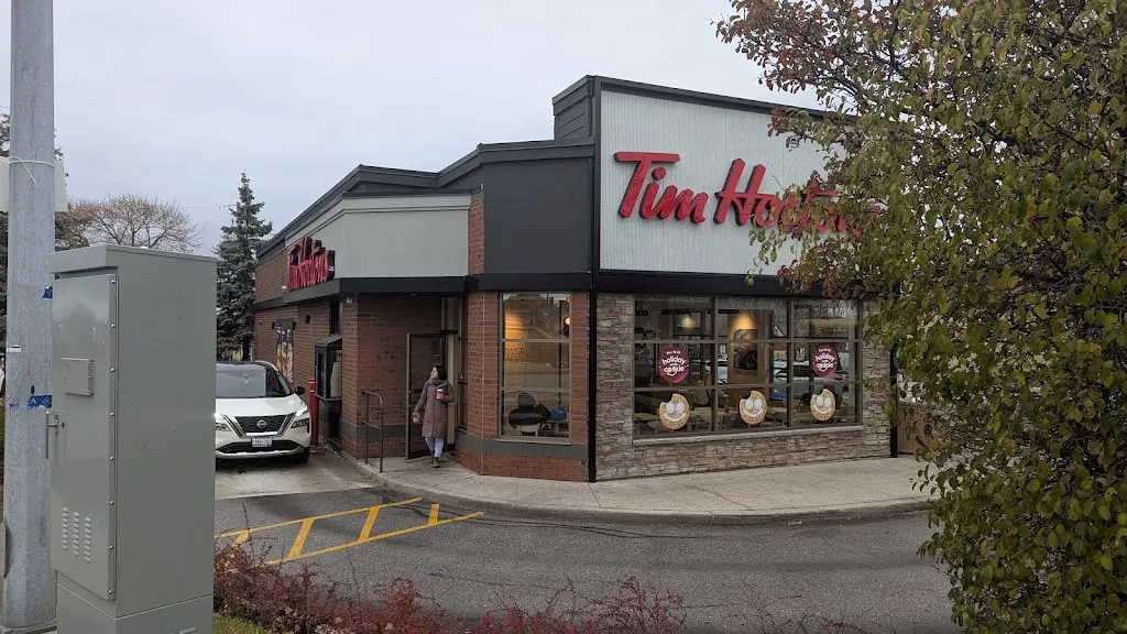Tim Hortons storefront and interior at 1900 O'connor Dr, North York, ON
