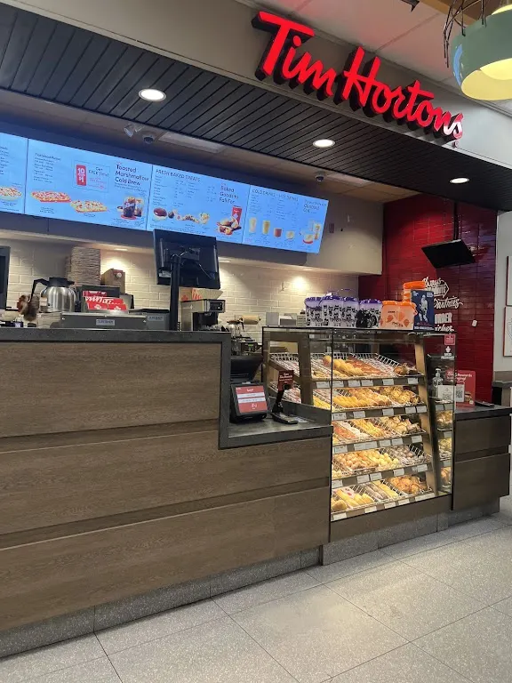 Tim Hortons storefront and interior at 110 Prescott Centre Dr, Prescott, ON