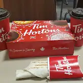 Tim Hortons storefront and interior at 105 St. Patrick Street, Thamesford, ON