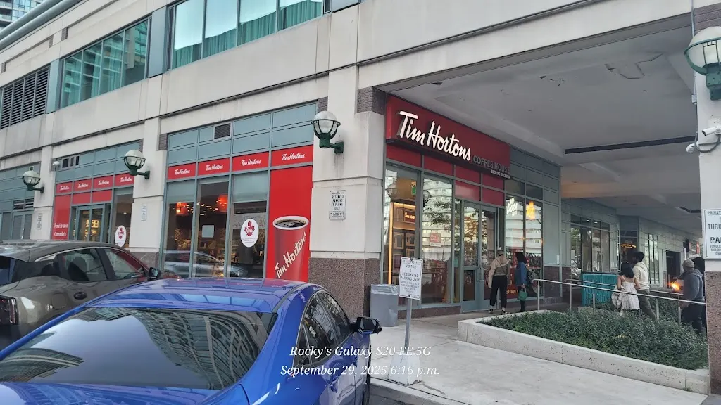 Tim Hortons storefront and interior at 16 Queens Quay West, Toronto, ON