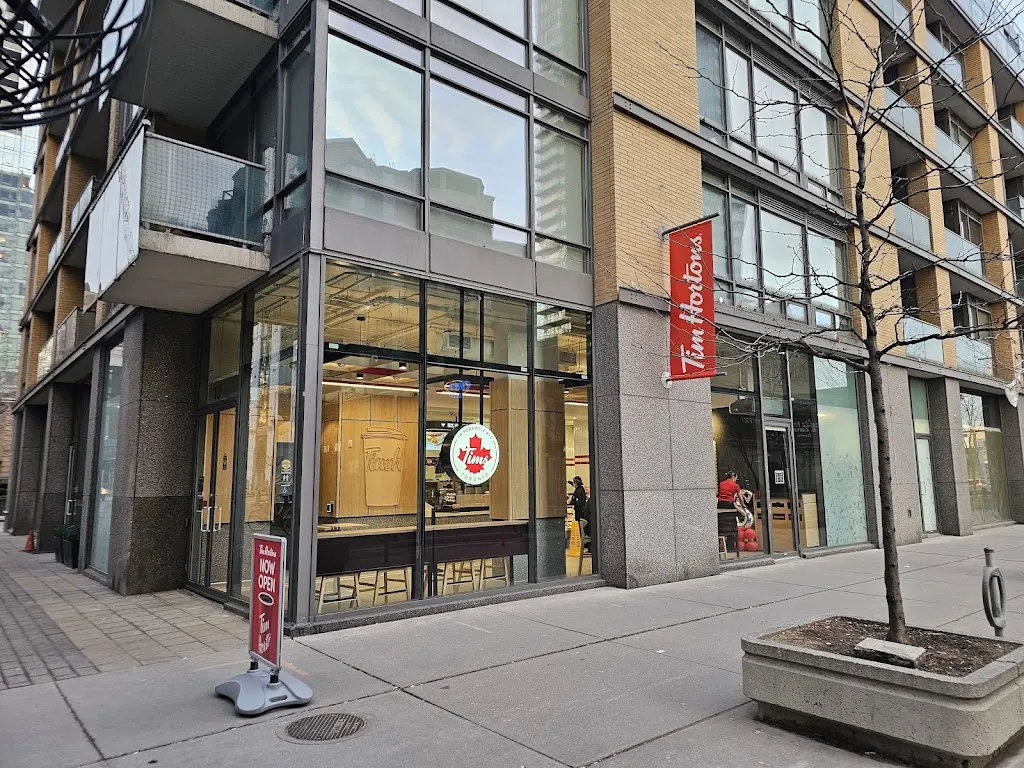 Tim Hortons storefront and interior at 18 Yorkville Avenue, Toronto, ON