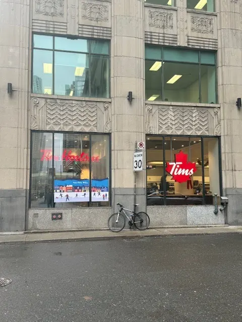 Tim Hortons storefront and interior at 55 York St, Toronto, ON