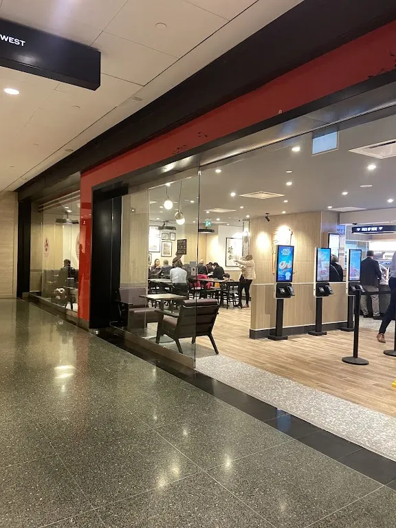 Tim Hortons storefront and interior at 77 King Street West, Toronto, ON