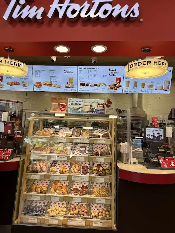 Tim Hortons storefront and interior at 150 Dupont St, Toronto, ON