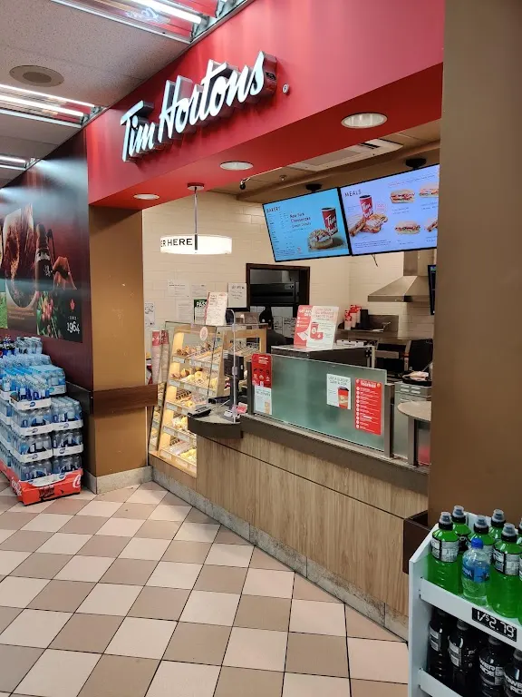 Tim Hortons storefront and interior at 256 Jarvis St, Toronto, ON