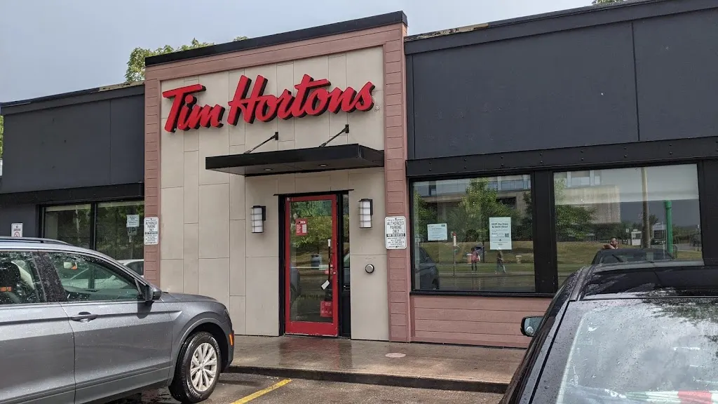 Tim Hortons storefront and interior at 547 Gerrard St East, Toronto, ON