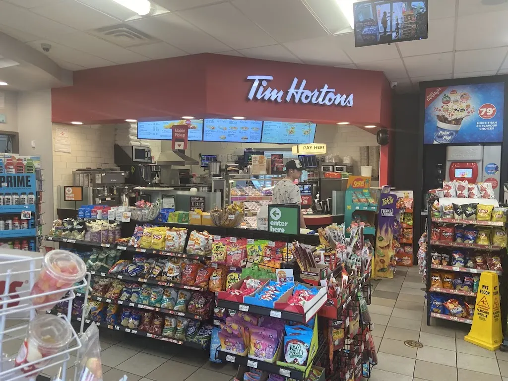 Tim Hortons storefront and interior at 1 Thornhill Woods Dr, Vaughan, ON