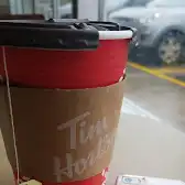 Tim Hortons storefront and interior at 1900 Mosley St, Wasaga Beach, ON