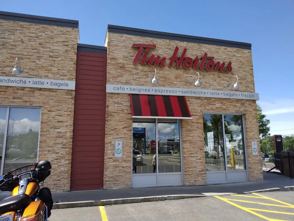 Tim Hortons storefront and interior at 1775 Ave Du Pont S, Alma, QC