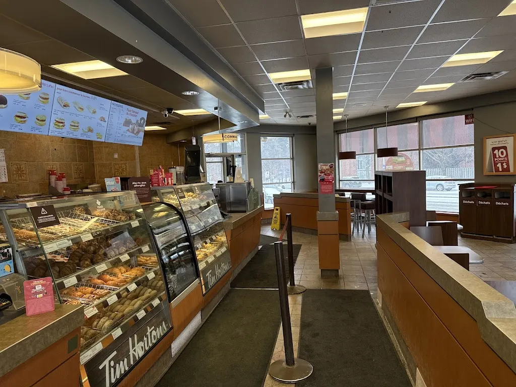 Tim Hortons storefront and interior at 7150 Rue Jarry Est, Anjou, QC