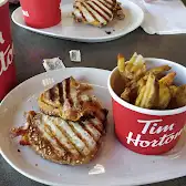 Tim Hortons storefront and interior at 1155 Boul Rome, Brossard, QC