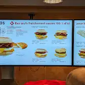 Tim Hortons storefront and interior at 2141, Boul. Lapiniere, Brossard, QC