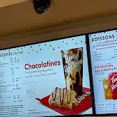 Tim Hortons storefront and interior at 5525 Av Auteuil, Brossard, QC