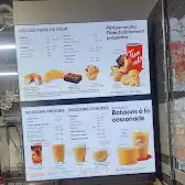 Tim Hortons storefront and interior at 6975 Philippine Street, Brossard, QC