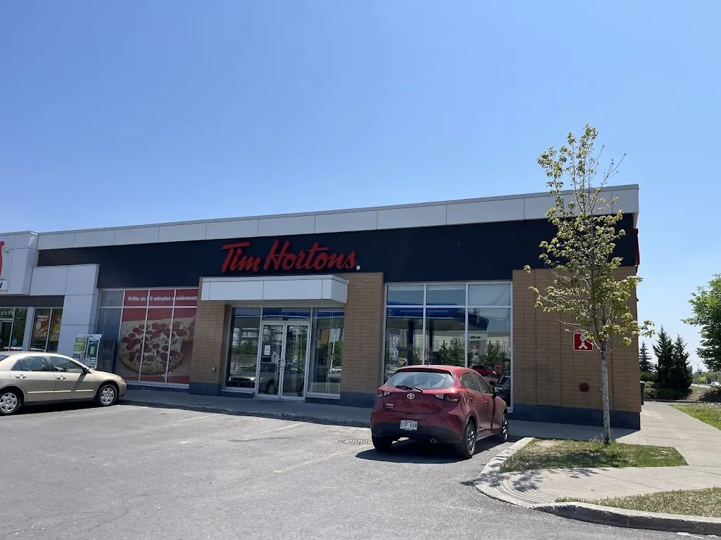 Tim Hortons storefront and interior at 8075 Blvd Du Quartier, Brossard, QC