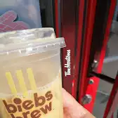 Tim Hortons storefront and interior at 8270 Boul Taschereau, Brossard, QC