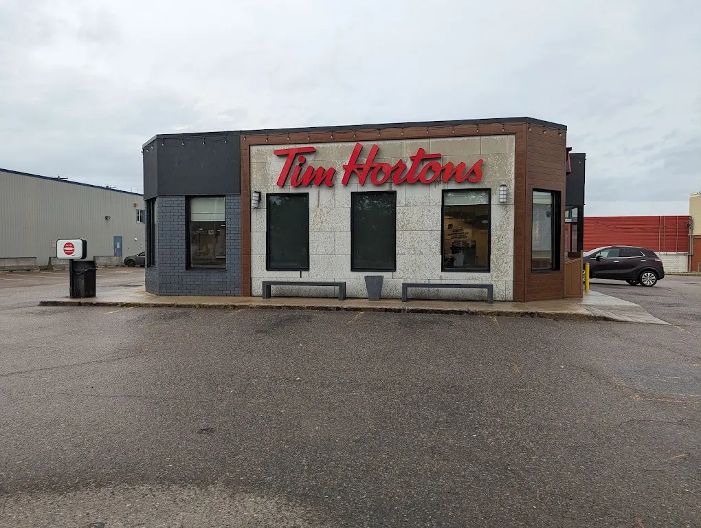 Tim Hortons storefront and interior at 1494 Boul Talbot, Chicoutimi, QC