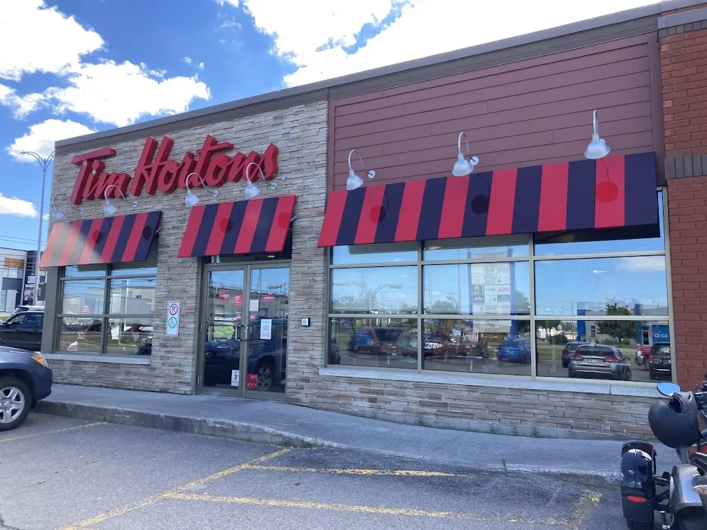 Tim Hortons storefront and interior at 1750 Boul St Paul, Chicoutimi, QC