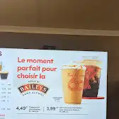 Tim Hortons storefront and interior at 1750 Boul St Paul, Chicoutimi, QC