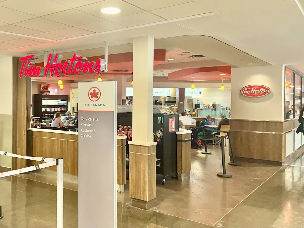 Tim Hortons storefront and interior at 975 Romeo Vachon Blvd N, Dorval, QC