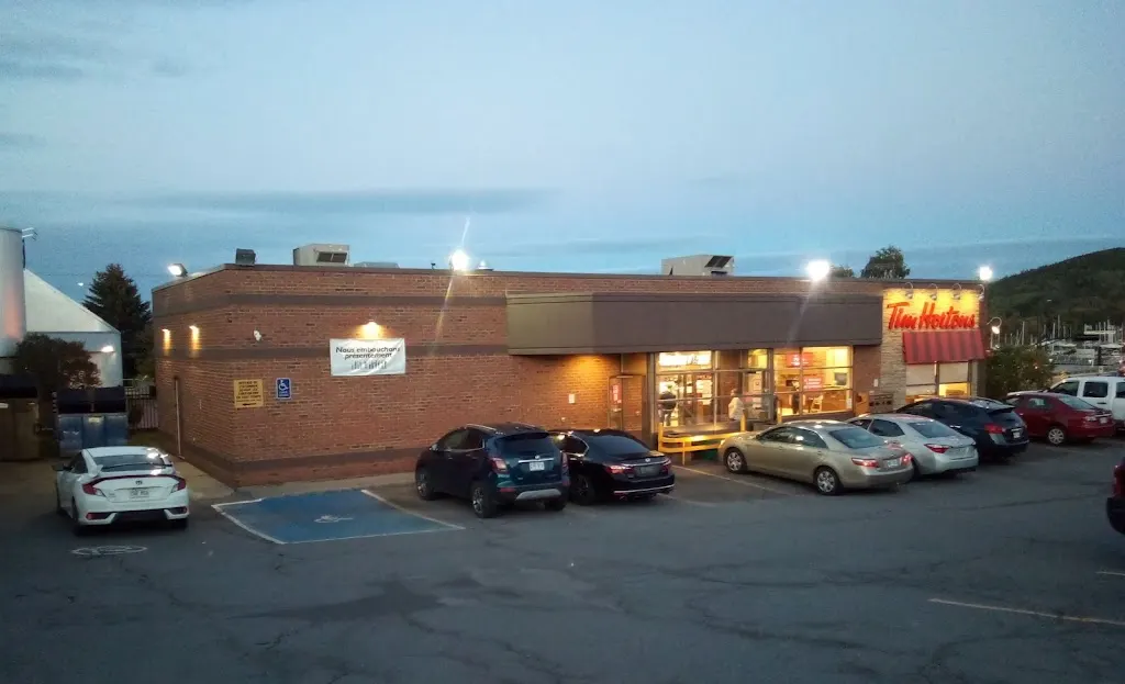Tim Hortons storefront and interior at 100 Rue De La Reine, Gaspé, QC