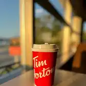 Tim Hortons storefront and interior at 100 Rue De La Reine, Gaspé, QC