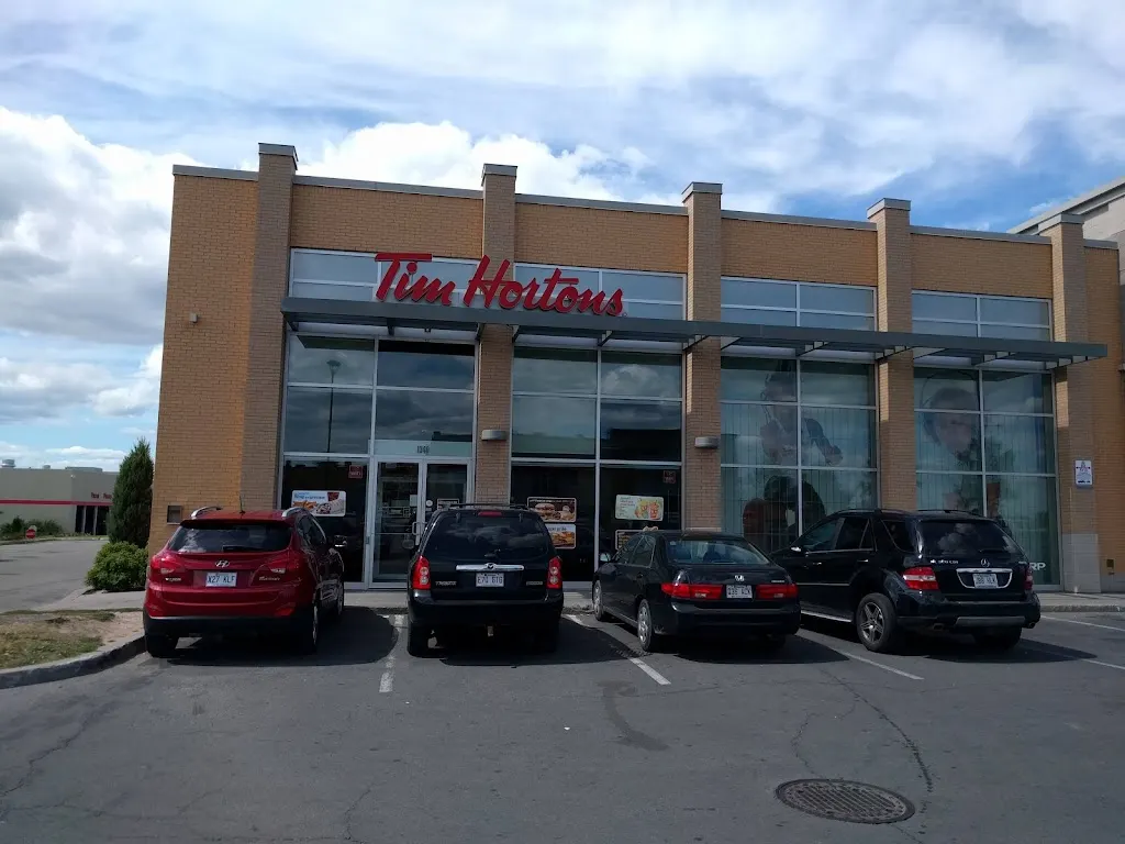 Tim Hortons storefront and interior at 1340, Boul. Le Corbusier, Laval, QC