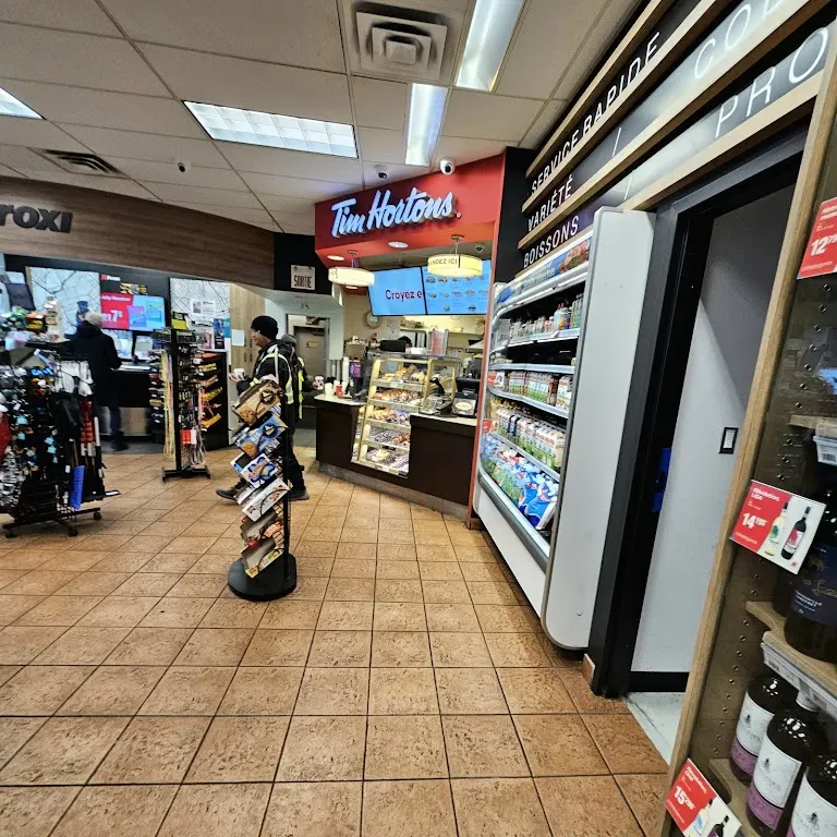 Tim Hortons storefront and interior at 4333 Autoroute Chomedey Ouest, Laval, QC