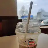 Tim Hortons storefront and interior at 310 Boul Roland-therrien, Longueuil, QC