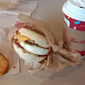 Tim Hortons storefront and interior at 2145 Boul Roland-therrien, Longueuil, QC