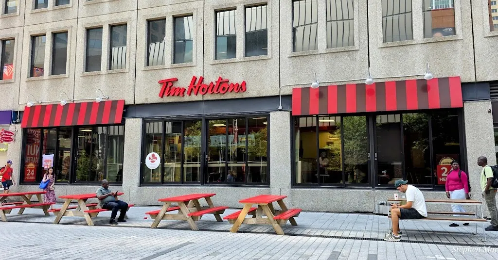 Tim Hortons storefront and interior at 93 Rue St Catherine Ouest, Montreal, QC