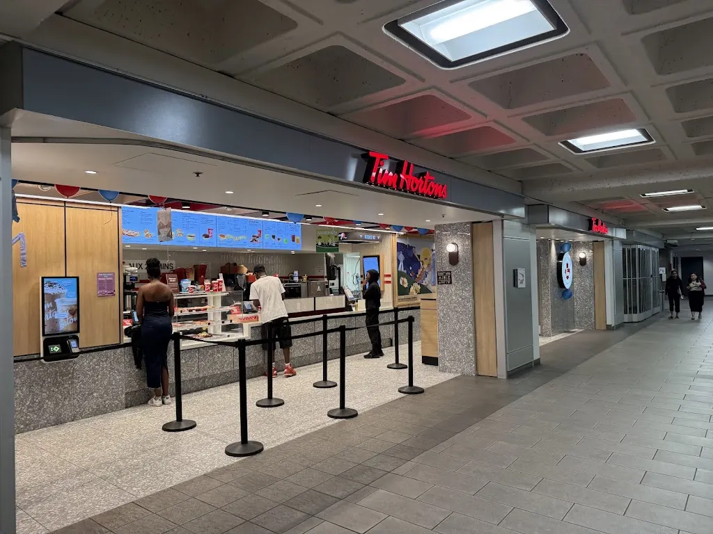 Tim Hortons storefront and interior at 800 - Rue De La Gauchetière O, Montreal, QC