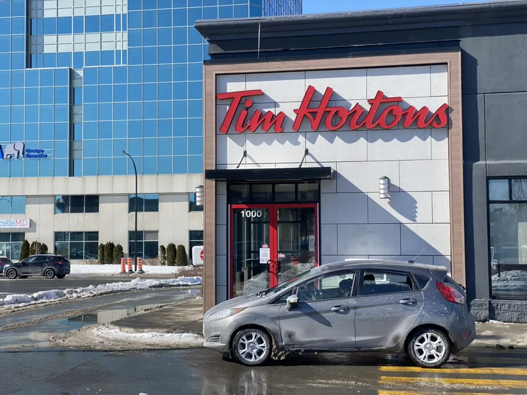 Tim Hortons storefront and interior at 1000 Rue Legendre Ouest, Montreal, QC