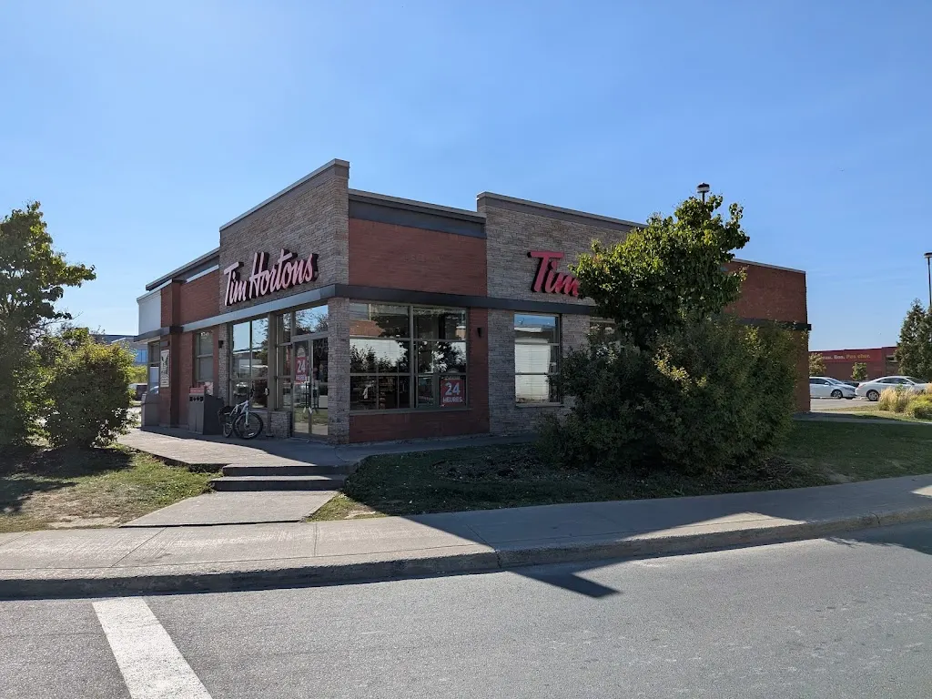 Tim Hortons storefront and interior at 8100 Boul Pie Ix, Montreal, QC