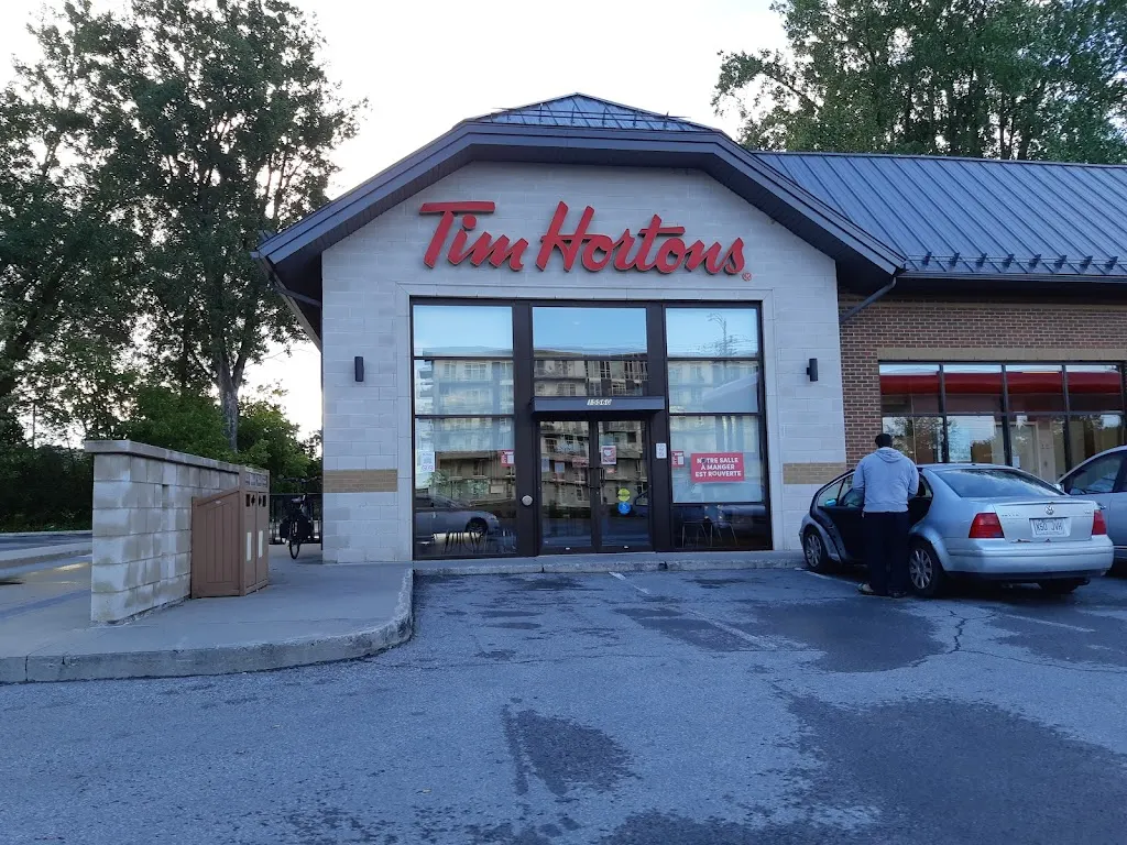 Tim Hortons storefront and interior at 15560 Rue Sherbrooke Est, Montreal, QC