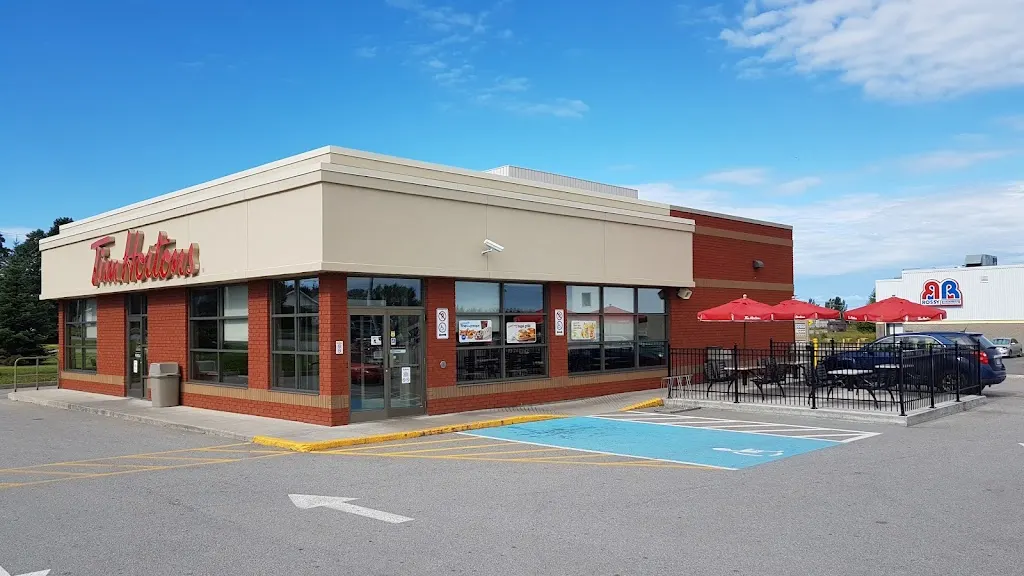 Tim Hortons storefront and interior at 306 Boul Arthur-buies Ouest, Rimouski, QC