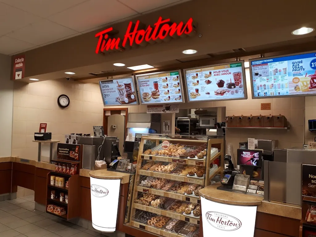 Tim Hortons storefront and interior at 3100 Blvd Moise Vincent, Saint Hubert, QC