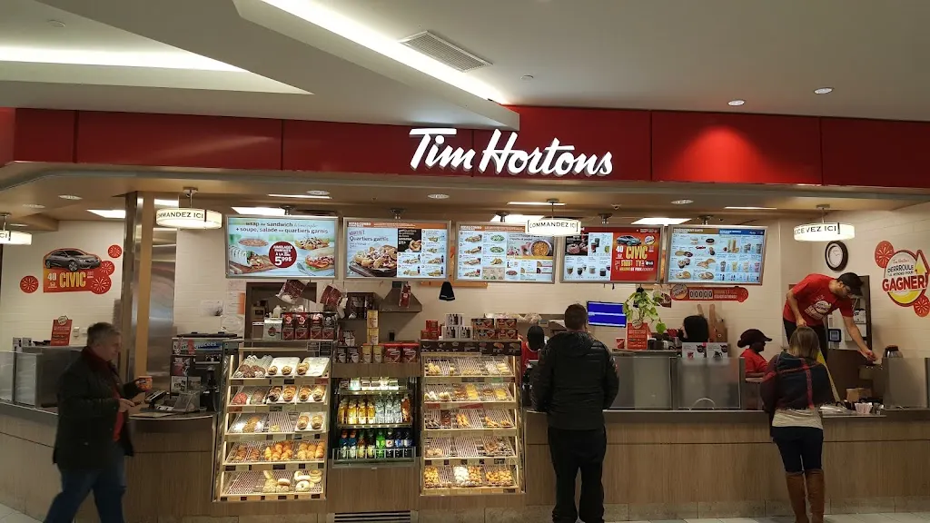 Tim Hortons storefront and interior at 3131, Boul. De La Cote-vertu, Saint-laurent, QC