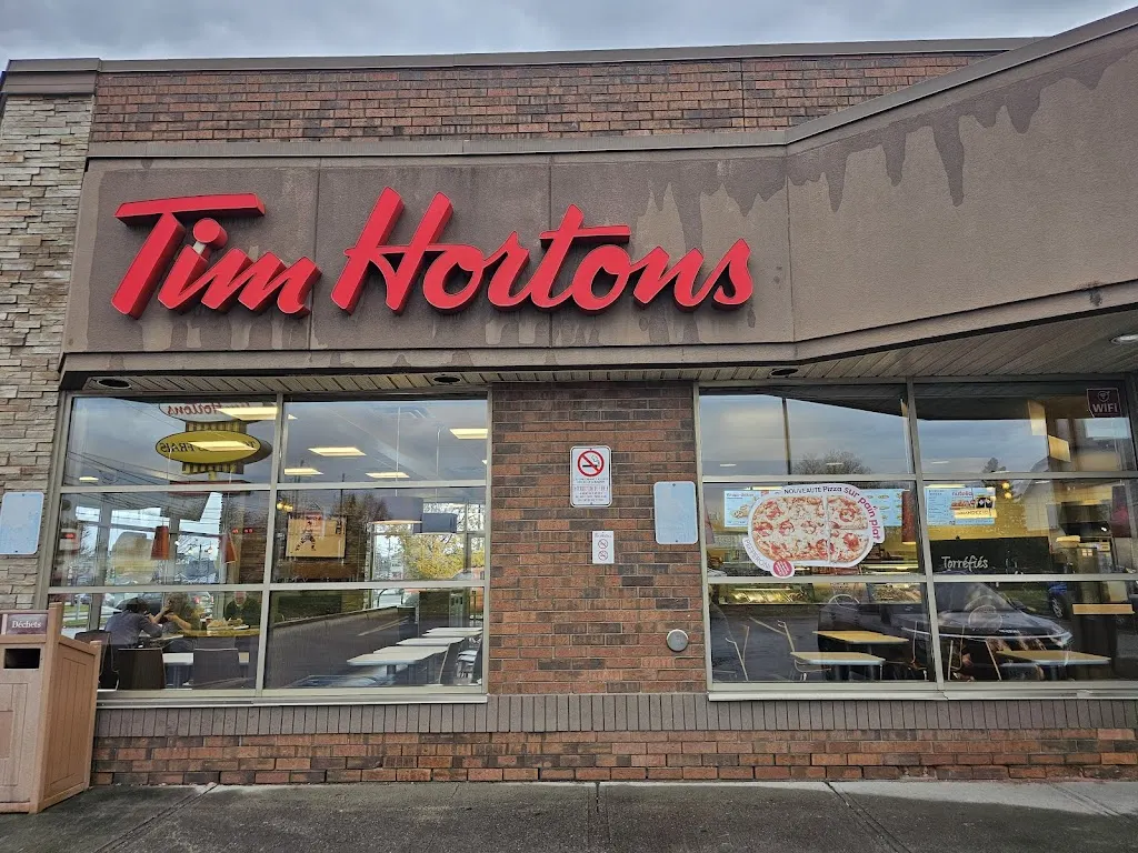 Tim Hortons storefront and interior at 210 Rue St Charles, Sainte-thérèse, QC