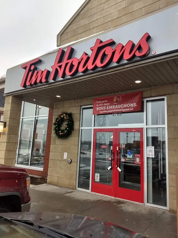 Tim Hortons storefront and interior at 2795 Claude Léveillée, Terrebonne, QC
