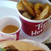 Tim Hortons storefront and interior at 30, Rue De L'eglise, Verdun, QC