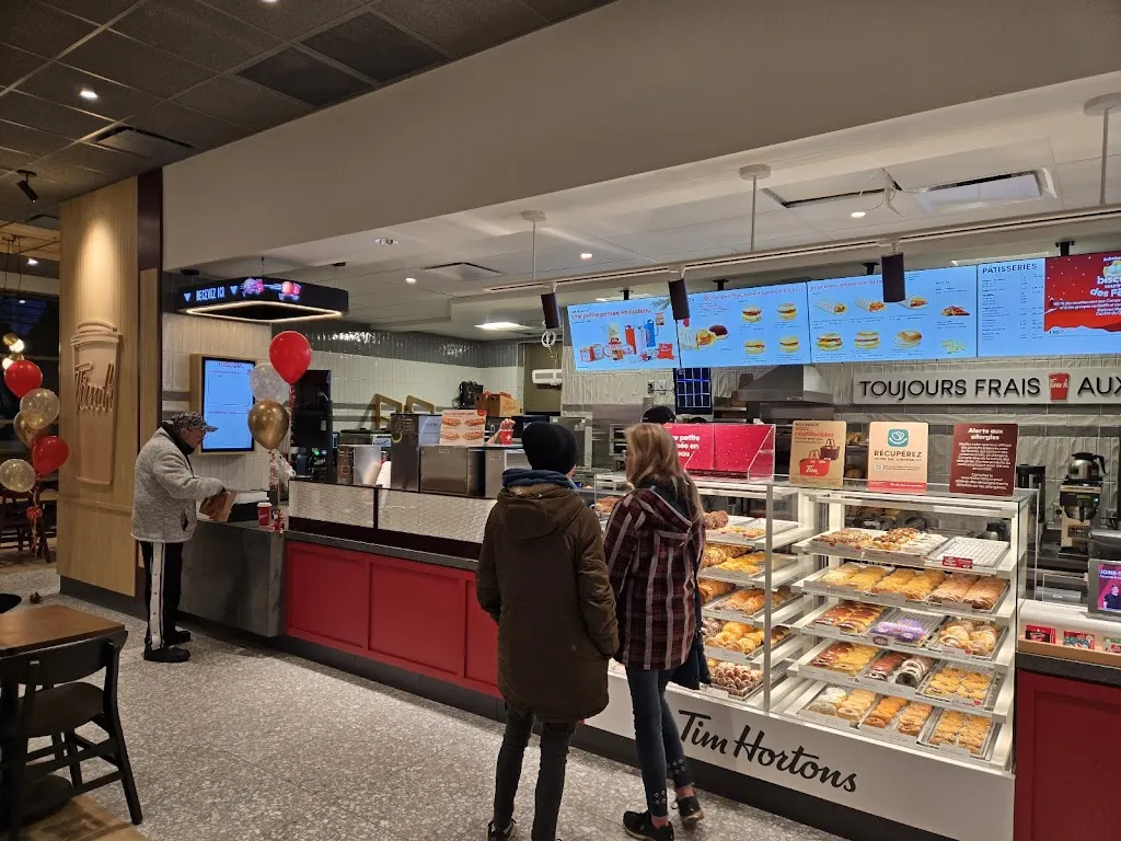 Tim Hortons storefront and interior at 90 Boul Des Bois-francs Sud, Victoriaville, QC